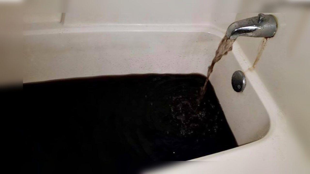 why is black water coming out the tub faucet